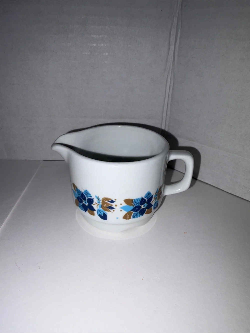 Vitro White Ceramic Creamer with Blue and Gold Floral Pattern